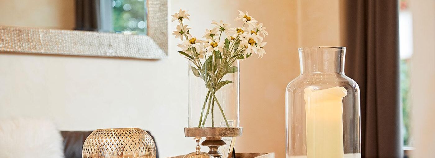Regulars' table of the hotel with table decoration and a large candle made of wax