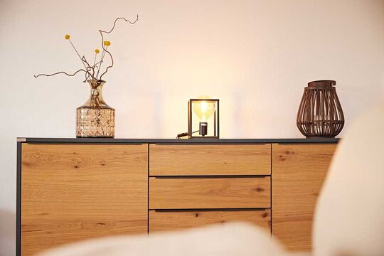 Close-up of the chest of drawers in the living room of the hotel's vacation apartment in Kierwang with decorations on it